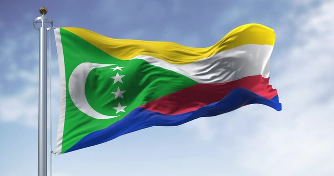 National flag of the Comoros waving in the wind on a clear day