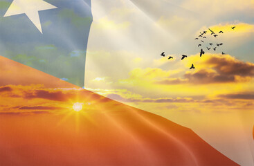 Waving the flag of Chile against the background of a sunset or sunrise. Chile flag for Independence...