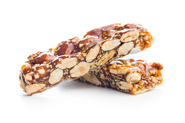 Close Up of almond Brittle Bars With Caramelized Coating isolated on white background.