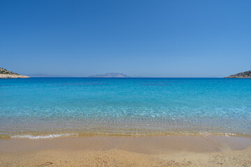View of the amazing sandy and turquoise beach of Agia Theodoti in Ios Greece