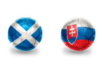 Obraz premium football balls with national flags of slovakia and scotland ,soccer teams. on the white background.