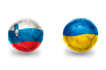 Fototapeta premium football balls with national flags of ukraine and slovenia ,soccer teams. on the white background.