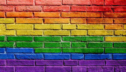 Fototapeta premium brick wall painted in the colors of the lgbt flag and rainbow, abstract texture background wallpaper for presentation close up full screen, queer lgbtq pride month