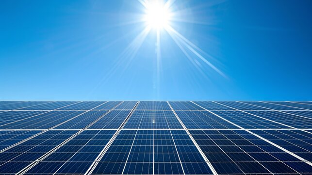 Panoramic shot of solar panel against clear blue sky with ample space for text placement