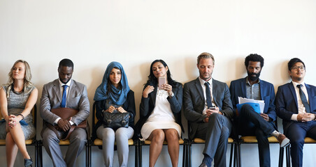 Group portrait, business people and waiting room for recruitment, interview and hr opportunity. Diversity, candidates and row in office for hiring, human resources and corporate job search together