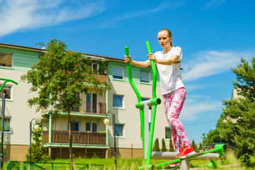 Girl exercise at outdoor gym area