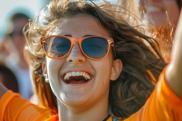 Vibrant young woman with sunglasses enjoying an outdoor event, expressing joy and excitement