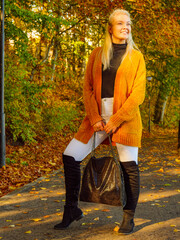 Woman walking in autumn park