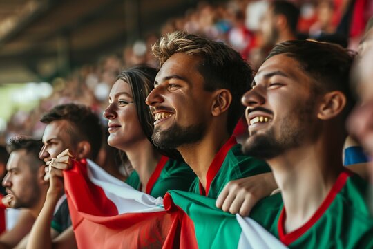 A vibrant crowd of supporters holding Portuguese flags and showing team spirit at a sports game