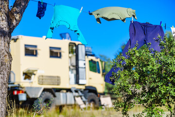 Camping. Clothes hanging to dry by rv lorry motorhome.