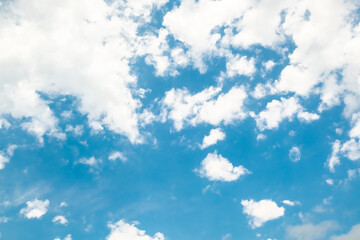 Obraz premium Soft blue sky with white clouds. Beautiful cosmetic background for advertising products