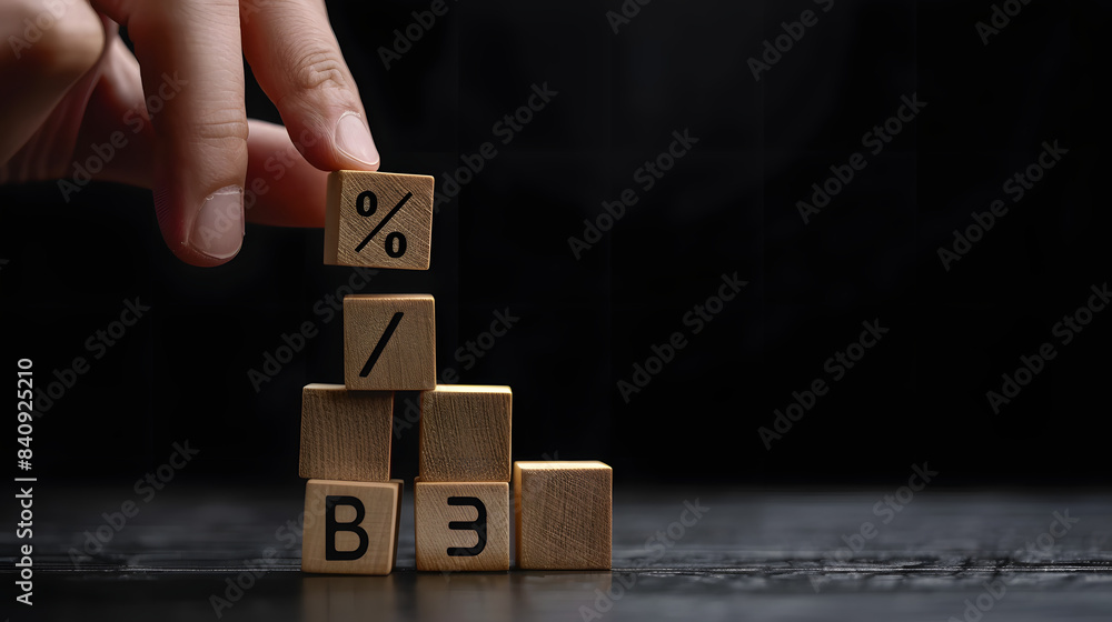 Poster hand adding wooden blocks with % sign to graph bar chart growth concept. black background