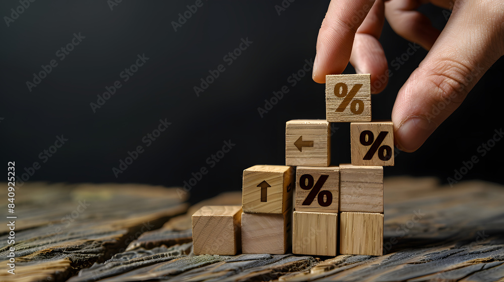 Poster hand adding wooden blocks with % sign to graph bar chart growth concept. black background