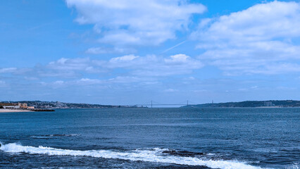 beautiful seascape with wave, blue sky and city view