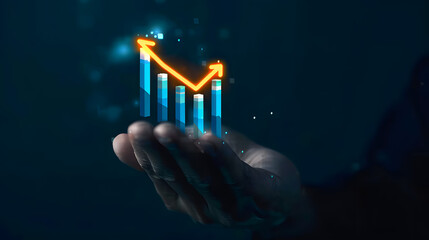 Hand holding rising graph arrow with bar chart on dark background