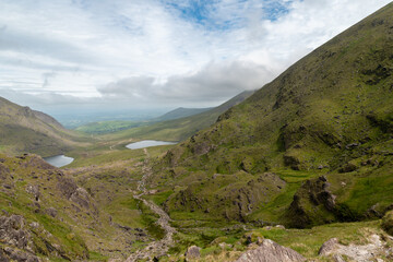 Panoramic view from Devils Ladder, one of most difficult trails, that is leading to highest Irish mountain Carrauntoohill or Carrantuohill is the highest mountain in Ireland at 1038m in Ring of Kerry