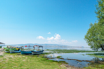 Fototapeta premium Scenic views of birds and Lake Işıklı (Işıklı Gölü), which is a freshwater lake in Turkey, on Çivril Plain, is an important site for breeding waterbirds and large numbers of winter wildfowl.
