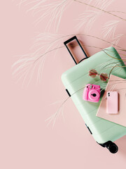 Green luggage with travel accessories on pink background with copy space. 3D Rendering, 3D...