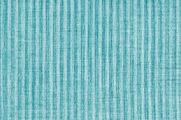 Ridge texture background of velour corduroy turquoise cloth. Large ribbed, coarse weaving...
