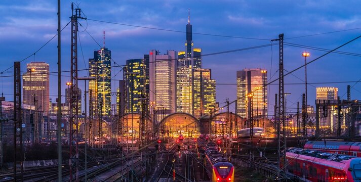 Train and tracks in front of main station and skyline Frankfurt Main in the evening, Gutleutviertel, Frankfurt, Hesse, Germany, Europe