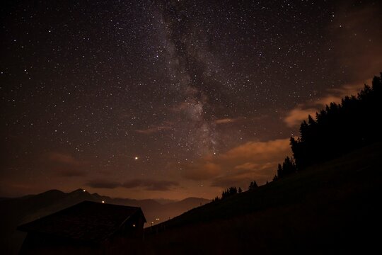 Night shot, mountain hut in the mountains, starry sky with milky way, Hochbrixen, Brixen im Thale, Tyrol, Austria, Europe