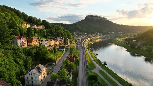 Aerial view of freight train passing along a valley