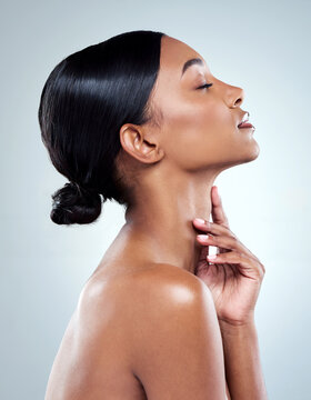 Skincare, woman and face in side view for beauty transformation with facial treatment in studio. Dermatology, female person or model with natural glow from cosmetics or collagen for wellness