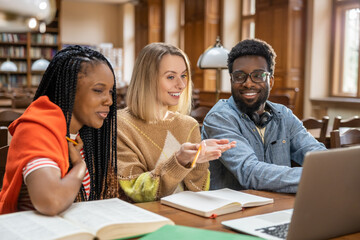 Group of young people working on the project together and looking involved