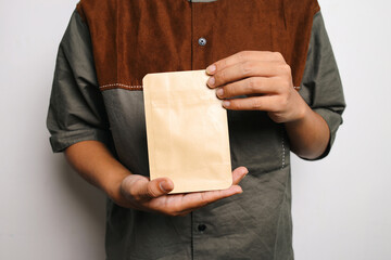 Hand Holding Paper Packaging Food In Center For Mockup Isolated On White Background