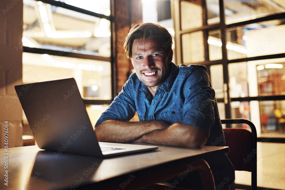 Poster laptop, night and portrait of man, smile and web developer in office, dark and working on deadline. 