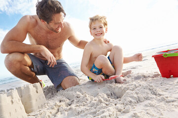 Father, boy or bucket for sand castle with smile on beach for vacation, sunshine in nature. Male...