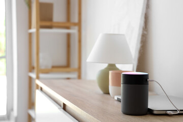 Air humidifier with laptop on commode in living room, closeup