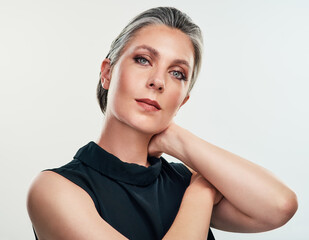 Portrait, makeup and mature woman with beauty by white background for cosmetics and wellness or...