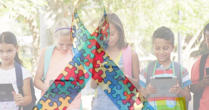 Image of colourful puzzle pieces over kids friends using electronic devices