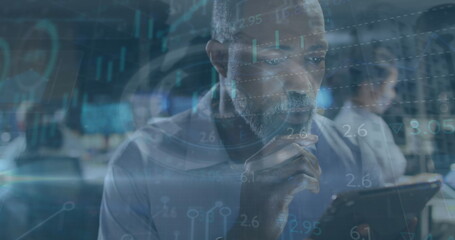 Image of data processing over businessman using tablet in office