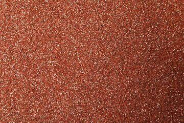 Beautiful shiny copper glitter as background, closeup