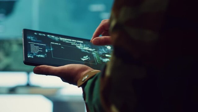 Special operations engineer following enemy warships or submarines to ensure safety within national territory. Navy IT specialist protecting the coast from hostile vessels. Close up. Camera A.