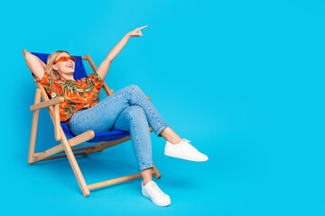 Photo of lovely cute girl wear trendy print clothes enjoy vacation look empty space isolated on...