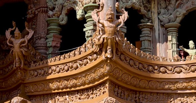 Intricate exterior wooden architecture of Garuda carving on The Sanctuary of Truth temple in Pattaya city, Thailand.