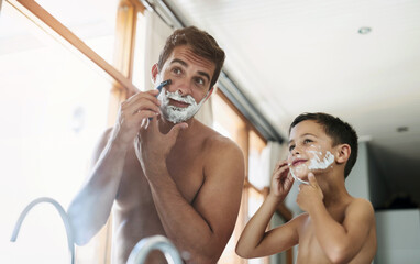 Bathroom, teaching and father shaving with kid for hygiene, grooming and health routine. Bonding, child development and boy learning razor facial epilation treatment with dad for skincare at home.