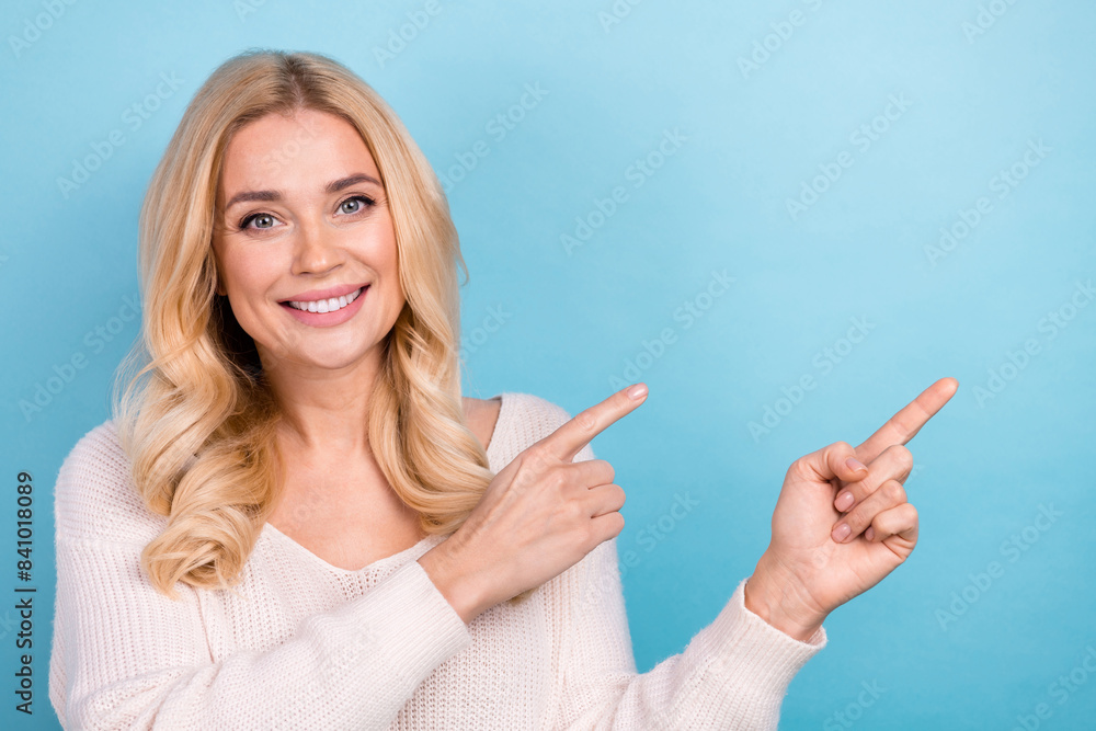 Sticker Photo of lovely nice woman wear stylish white clothes demonstrate empty space isolated on blue color background