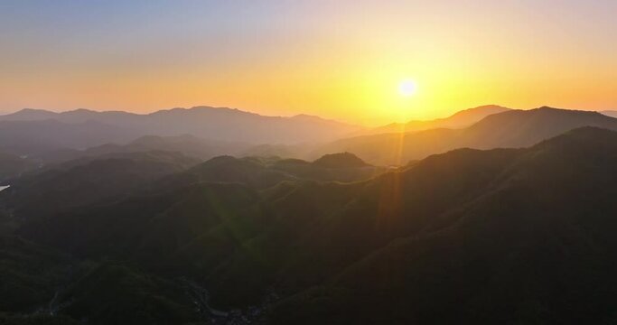 Aerial view of beautiful mountains nature landscape at sunset. Backlit mountain background.