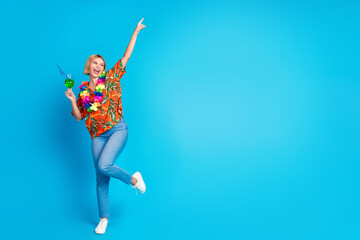 Photo of glad nice cool cute girl wear stylish print clothes have fun weekend look empty space isolated on blue color background © deagreez