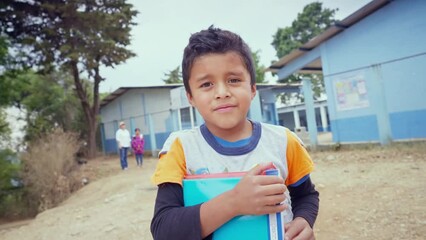 Portrait of a student boy in front of a public education building. - Powered by Adobe