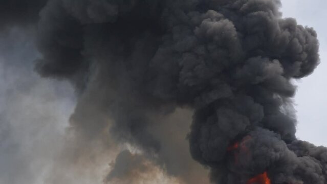 Black smoke caused by burning plastic from cause of fire industrial plant
