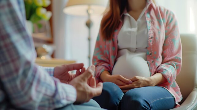 Preparing for childbirth, close-up of a pregnant woman visiting a doctor at a prenatal clinic, prenatal care center, in a doctor's examination room.