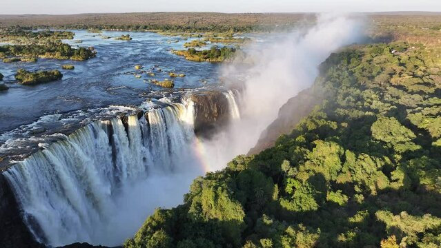 Famous Water Falls At Victoria Falls In Matabeleland North Zimbabwe. Giant Waterfalls. Nature Landscape. Victoria Falls At Matabeleland North Zimbabwe. Zambezi River. Travel Scenery.