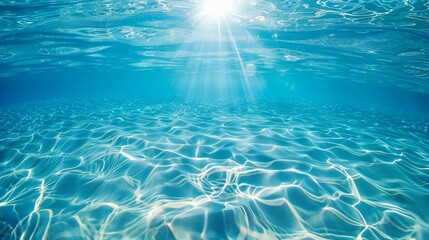 太陽光が差し込む青い海の水中風景
