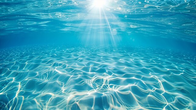 太陽光が差し込む青い海の水中風景
