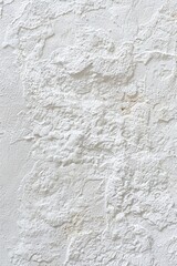 Obraz premium An abstract texture pattern of paper or plaster in soft white. 